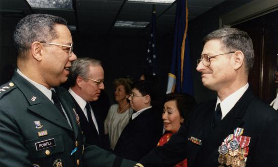 Chairman of the Joint Chiefs General Colin Powell greets Captain Swartz at his retirement ceremony in 1993